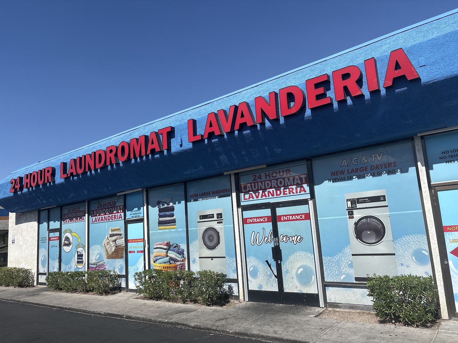 Daytime exterior of the 24 Hour Laundromat Lavanderia storefront in Las Vegas